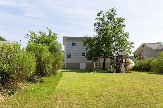 125 Messick Rd, Poquoson, VA 23662 - view of green lawn with a playground