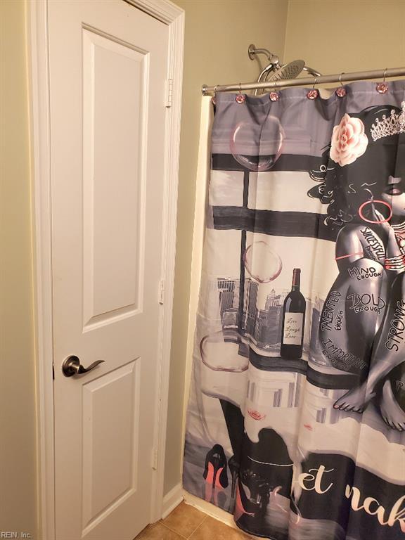 bathroom view of a shower with curtain