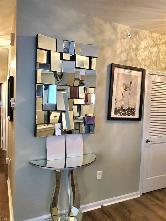 detailed view of baseboards and wood finished floors