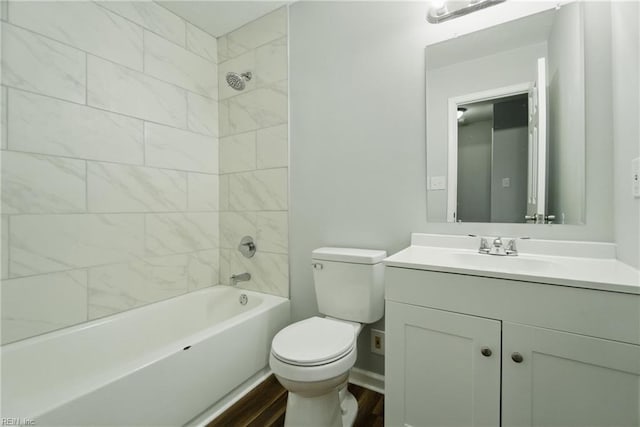 full bathroom featuring toilet, vanity,  shower combination, and wood finished floors