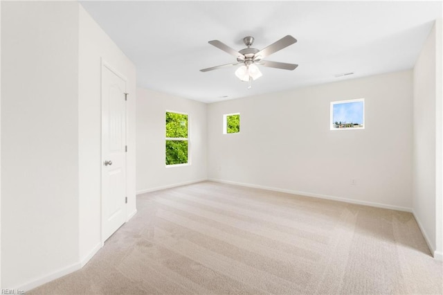 3127 Lens Ave, Norfolk, VA 23509 - unfurnished room with baseboards, light colored carpet, and a ceiling fan