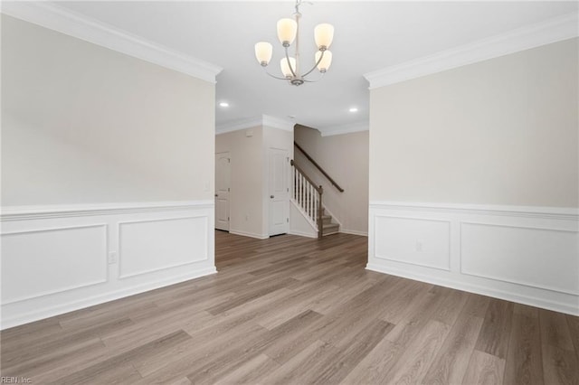 3127 Lens Ave, Norfolk, VA 23509 - spare room featuring stairway, crown molding, a chandelier, a decorative wall, and recessed lighting