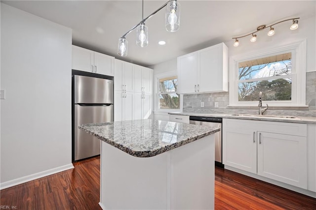 9 Prince George Dr, Hampton, VA 23669 - kitchen featuring stainless steel appliances, a sink, decorative backsplash, and light stone counters