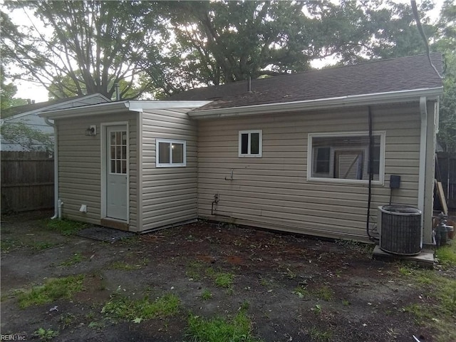 1914 Long Green Ln, Hampton, VA 23663 - back of house with central AC, fence, and roof with shingles