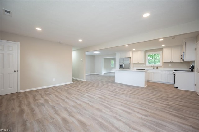 837 Mount Pleasant Rd, Chesapeake, VA 23322 - kitchen featuring appliances with stainless steel finishes, open floor plan, a kitchen island, light wood-style floors, and recessed lighting