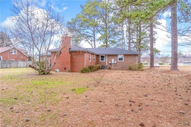 837 Mount Pleasant Rd, Chesapeake, VA 23322 - rear view of house with brick siding, fence, and a chimney