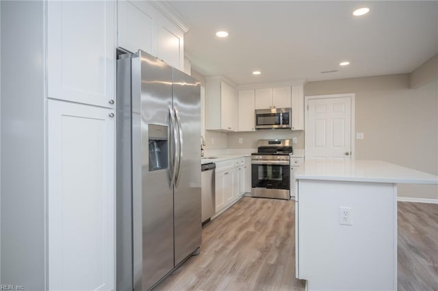 837 Mount Pleasant Rd, Chesapeake, VA 23322 - kitchen featuring appliances with stainless steel finishes, light countertops, white cabinetry, light wood-type flooring, and recessed lighting