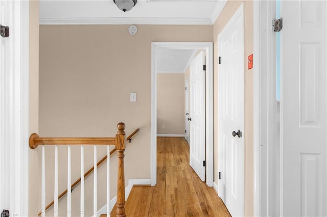 2124 Thackeray Ln, Virginia Beach, VA 23454 - corridor with light wood-type flooring, crown molding, an upstairs landing, and baseboards