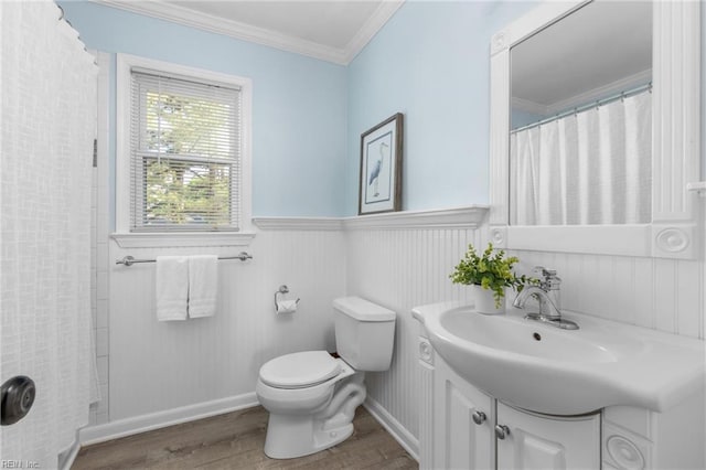 2124 Thackeray Ln, Virginia Beach, VA 23454 - bathroom featuring wood finished floors, wainscoting, crown molding, toilet, and vanity