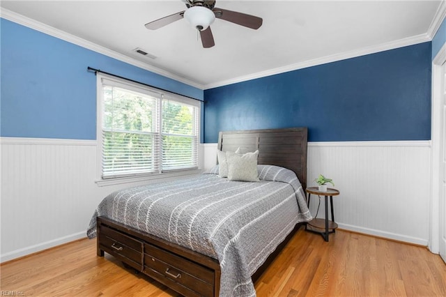 2124 Thackeray Ln, Virginia Beach, VA 23454 - bedroom with a wainscoted wall, light wood finished floors, ceiling fan, and ornamental molding
