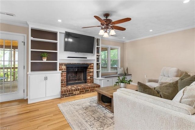 2124 Thackeray Ln, Virginia Beach, VA 23454 - living area with ornamental molding, light wood-type flooring, recessed lighting, a ceiling fan, and a fireplace