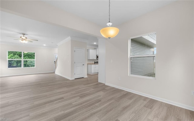 empty room with light wood-style floors, baseboards, a ceiling fan, recessed lighting, and ornamental molding