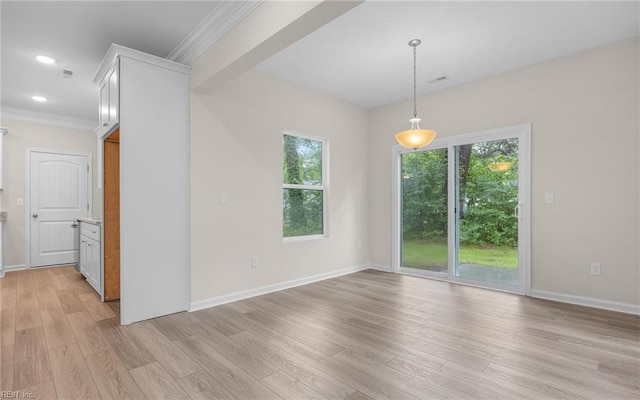 unfurnished room with light wood-style flooring, ornamental molding, baseboards, and recessed lighting