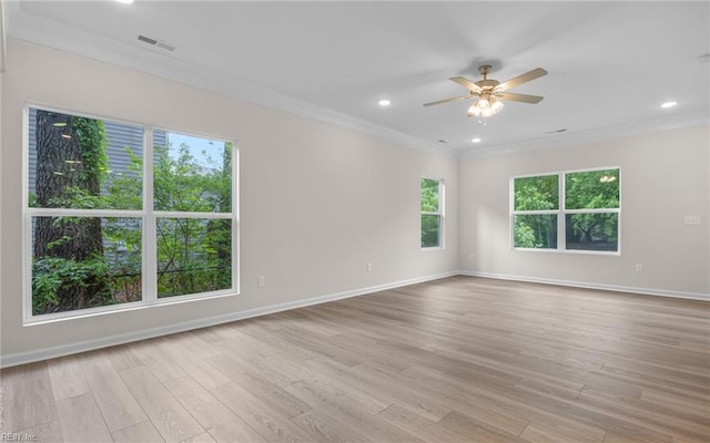 unfurnished room with ornamental molding, a ceiling fan, light wood-type flooring, baseboards, and recessed lighting