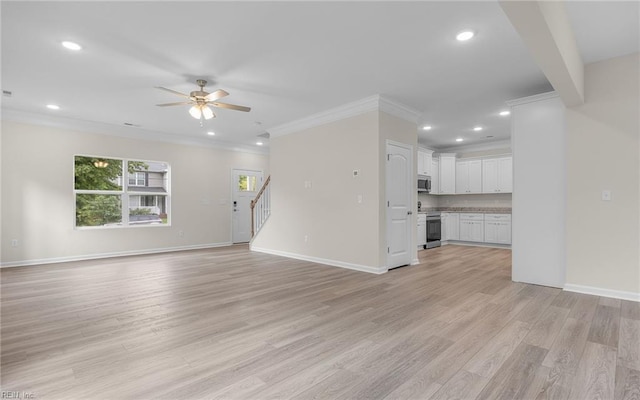 unfurnished living room featuring ornamental molding, ceiling fan, stairway, recessed lighting, and baseboards