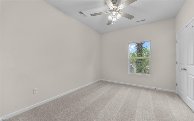 unfurnished bedroom with baseboards, light colored carpet, and a ceiling fan