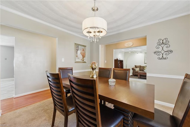 6701 Burbage Landing Cir, Suffolk, VA 23435 - dining room with a chandelier, ornamental molding, carpet floors, and baseboards