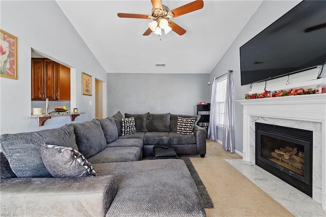 6701 Burbage Landing Cir, Suffolk, VA 23435 - living room with lofted ceiling, ceiling fan, a high end fireplace, and light colored carpet