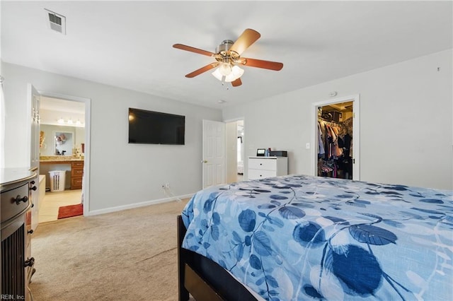 6701 Burbage Landing Cir, Suffolk, VA 23435 - bedroom featuring light colored carpet, a spacious closet, baseboards, ceiling fan, and ensuite bath