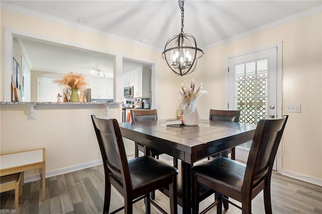 504 Amster Ln, Chesapeake, VA 23323 - dining room with a chandelier, light wood-style flooring, ornamental molding, and baseboards