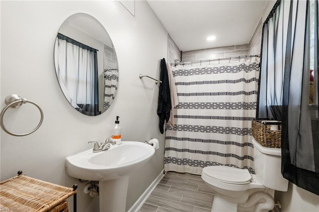 504 Amster Ln, Chesapeake, VA 23323 - full bathroom with toilet, a shower with curtain, wood tiled floors, and baseboards