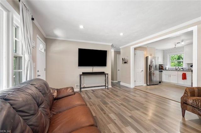 504 Amster Ln, Chesapeake, VA 23323 - living area with ornamental molding, light wood-style floors, baseboards, and recessed lighting