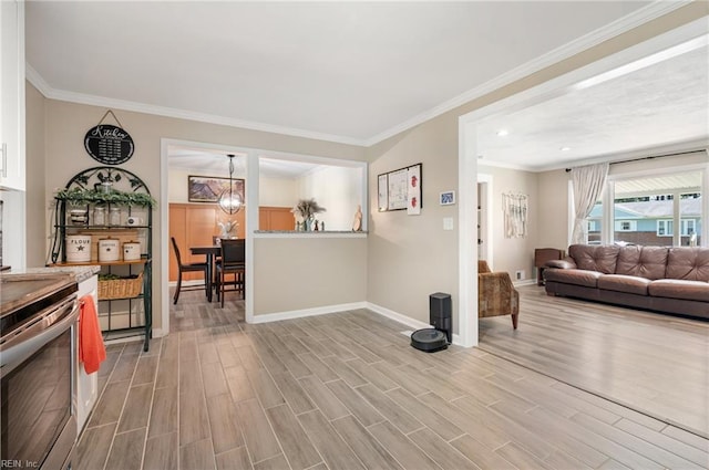 504 Amster Ln, Chesapeake, VA 23323 - living room with baseboards, wood finished floors, crown molding, and recessed lighting