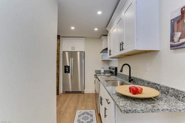 1413 Elm Ave, Portsmouth, VA 23704 - kitchen with appliances with stainless steel finishes, a sink, extractor fan, white cabinetry, and recessed lighting