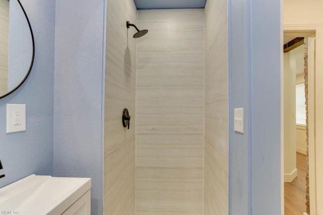1413 Elm Ave, Portsmouth, VA 23704 - bathroom with tiled shower and wood finished floors