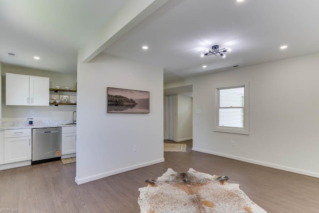1413 Elm Ave, Portsmouth, VA 23704 - kitchen with dishwasher, open shelves, wood finished floors, white cabinetry, and recessed lighting