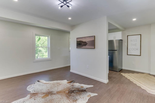 1413 Elm Ave, Portsmouth, VA 23704 - spare room with wood finished floors, baseboards, and recessed lighting