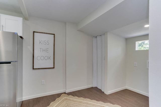 1413 Elm Ave, Portsmouth, VA 23704 - basement featuring freestanding refrigerator, wood finished floors, and baseboards