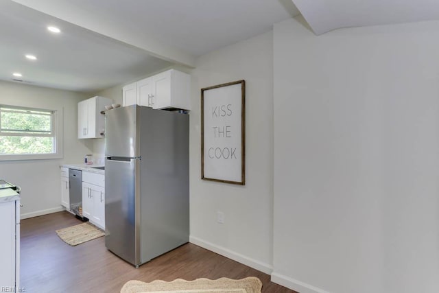 1413 Elm Ave, Portsmouth, VA 23704 - kitchen with stainless steel appliances, wood finished floors, white cabinets, light countertops, and baseboards