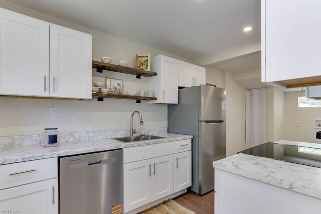 1413 Elm Ave, Portsmouth, VA 23704 - kitchen featuring appliances with stainless steel finishes, a sink, open shelves, white cabinets, and light wood-type flooring