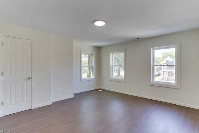 1413 Elm Ave, Portsmouth, VA 23704 - spare room with dark wood finished floors and baseboards