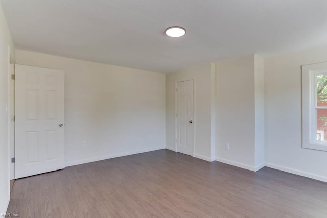 1413 Elm Ave, Portsmouth, VA 23704 - spare room featuring wood finished floors and baseboards
