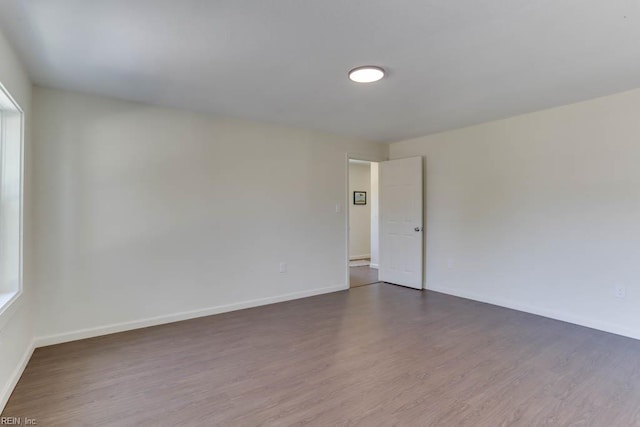 1413 Elm Ave, Portsmouth, VA 23704 - spare room with dark wood-style floors and baseboards