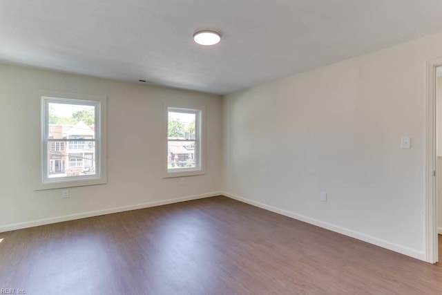 1413 Elm Ave, Portsmouth, VA 23704 - empty room with wood finished floors and baseboards