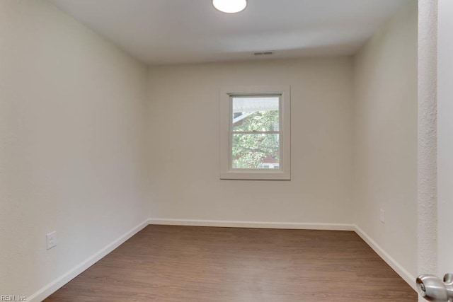 1413 Elm Ave, Portsmouth, VA 23704 - empty room featuring wood finished floors and baseboards