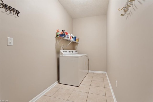 218 Woodburne Ln, Newport News, VA 23602 - clothes washing area with separate washer and dryer, a textured ceiling, light tile patterned floors, and baseboards
