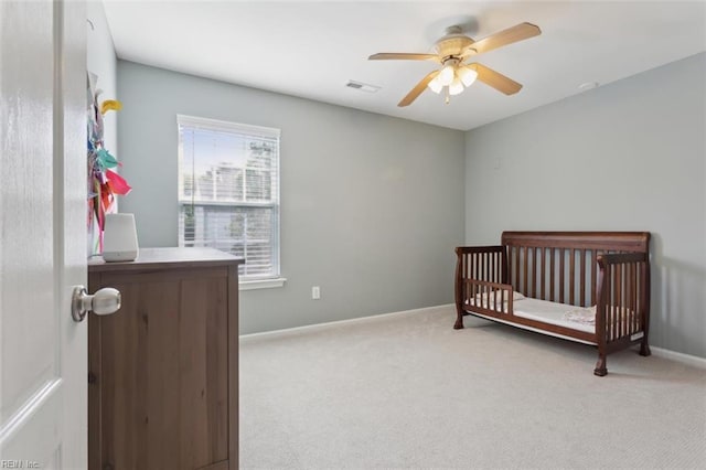 218 Woodburne Ln, Newport News, VA 23602 - carpeted bedroom featuring a crib, baseboards, and a ceiling fan