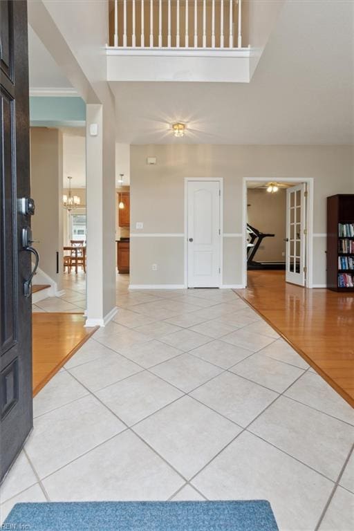 218 Woodburne Ln, Newport News, VA 23602 - entryway with light tile patterned floors, french doors, a chandelier, baseboards, and a high ceiling