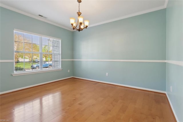 218 Woodburne Ln, Newport News, VA 23602 - empty room with a chandelier, wood finished floors, baseboards, and crown molding