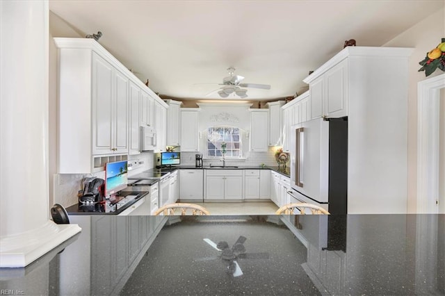 433 Croatan Rd, Virginia Beach, VA 23451 - kitchen with white appliances, tasteful backsplash, ceiling fan, a sink, and white cabinets