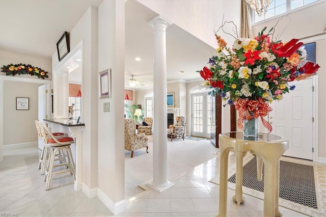 433 Croatan Rd, Virginia Beach, VA 23451 - foyer entrance featuring decorative columns, light tile patterned floors, baseboards, a ceiling fan, and crown molding