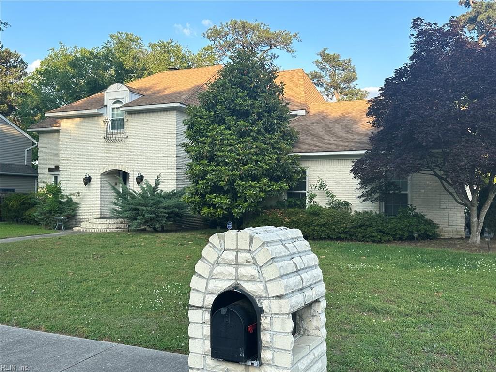2537 Lakewood Ln, Chesapeake, VA 23321 - view of property exterior featuring a lawn and brick siding