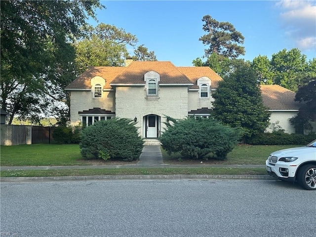 2537 Lakewood Ln, Chesapeake, VA 23321 - french country home with a chimney and brick siding