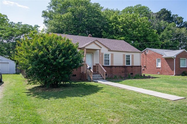 16 Warner Rd, Hampton, VA 23666 - view of front of home with brick siding and a front lawn