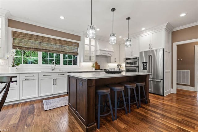 1704 Lower Church Ct, Virginia Beach, VA 23455 - kitchen with stainless steel appliances, dark wood-style floors, white cabinetry, crown molding, and light countertops