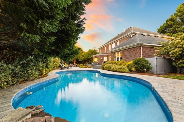 1704 Lower Church Ct, Virginia Beach, VA 23455 - pool at dusk featuring an outdoor pool and a patio